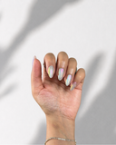 Aurora Pearl Almond press-on nails with radiant pearl finish and holographic shimmer by NEWRUSH