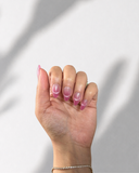 Pink Martini Almond luxury press-on nails with soft pink ombre and champagne shimmer by NEWRUSH