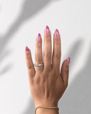 Pink Martini Almond luxury press-on nails with soft pink ombre and champagne shimmer by NEWRUSH
