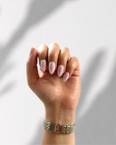 Korean Blush Almond press-on nails with soft blush pink tones and glossy milky white finish by NEWRUSH