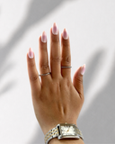 Korean Blush Almond press-on nails with soft blush pink tones and glossy milky white finish by NEWRUSH