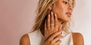 Leo Cat Blush Almond press-on nails by NEWRUSH on model with gold jewelry