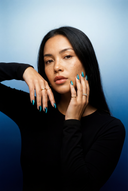 Teal Galaxy Almond luxury press-on nails with teal cat eye effect and shimmering finish by NEWRUSH